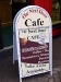 White BOOSTER sign with Café graphics
