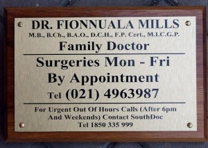 Brushed stainless steel effect plaque with timber backing