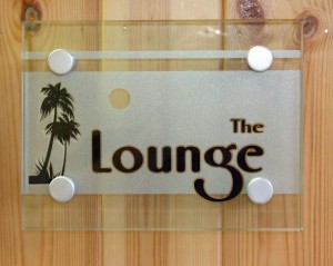 Glass plaque with fixings