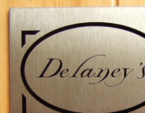 Brushed stainless steel plaque detail